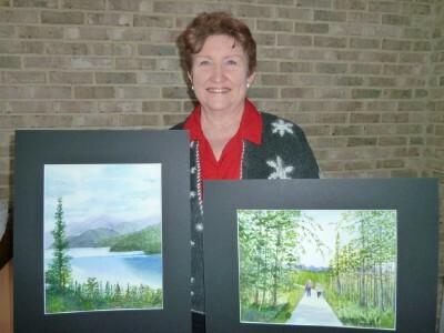 Joyce Grothaus with her two latest paintings